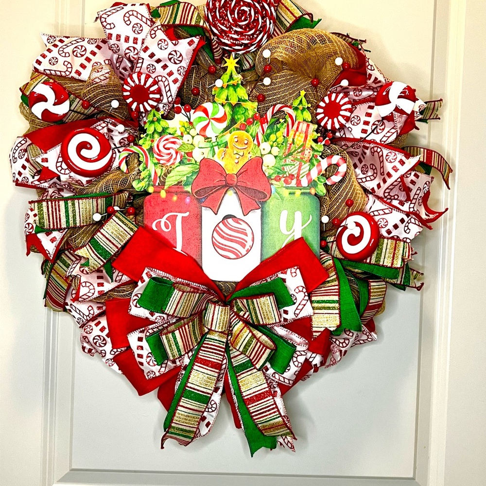 Festive Christmas holiday wreath with peppermint candy